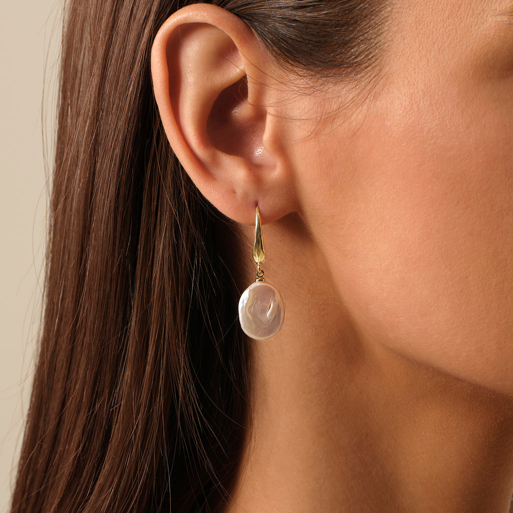 Aura Pearl PFE1160-SY pearl drop earrings worn on ear