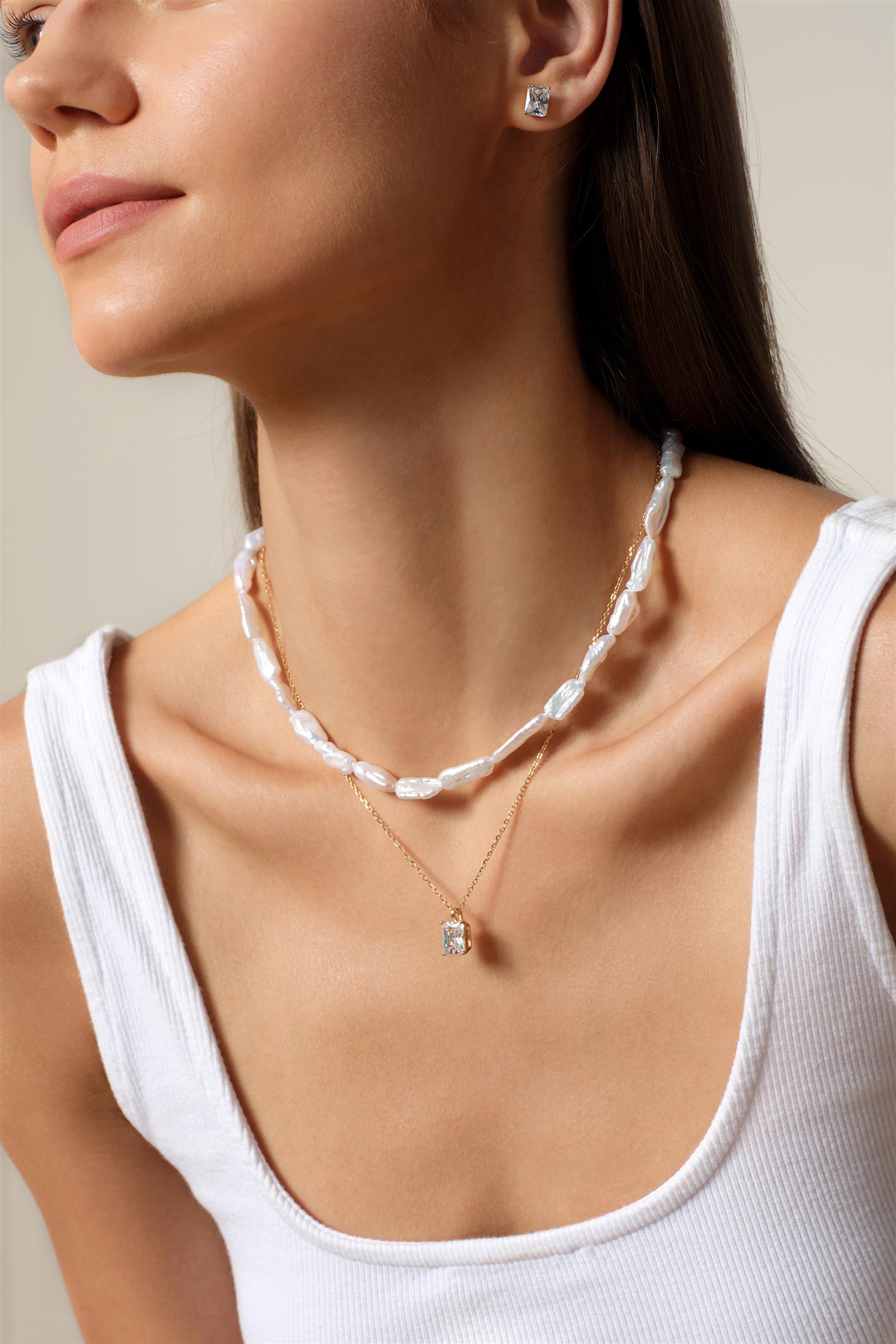 Pearl necklace worn with a white everyday top