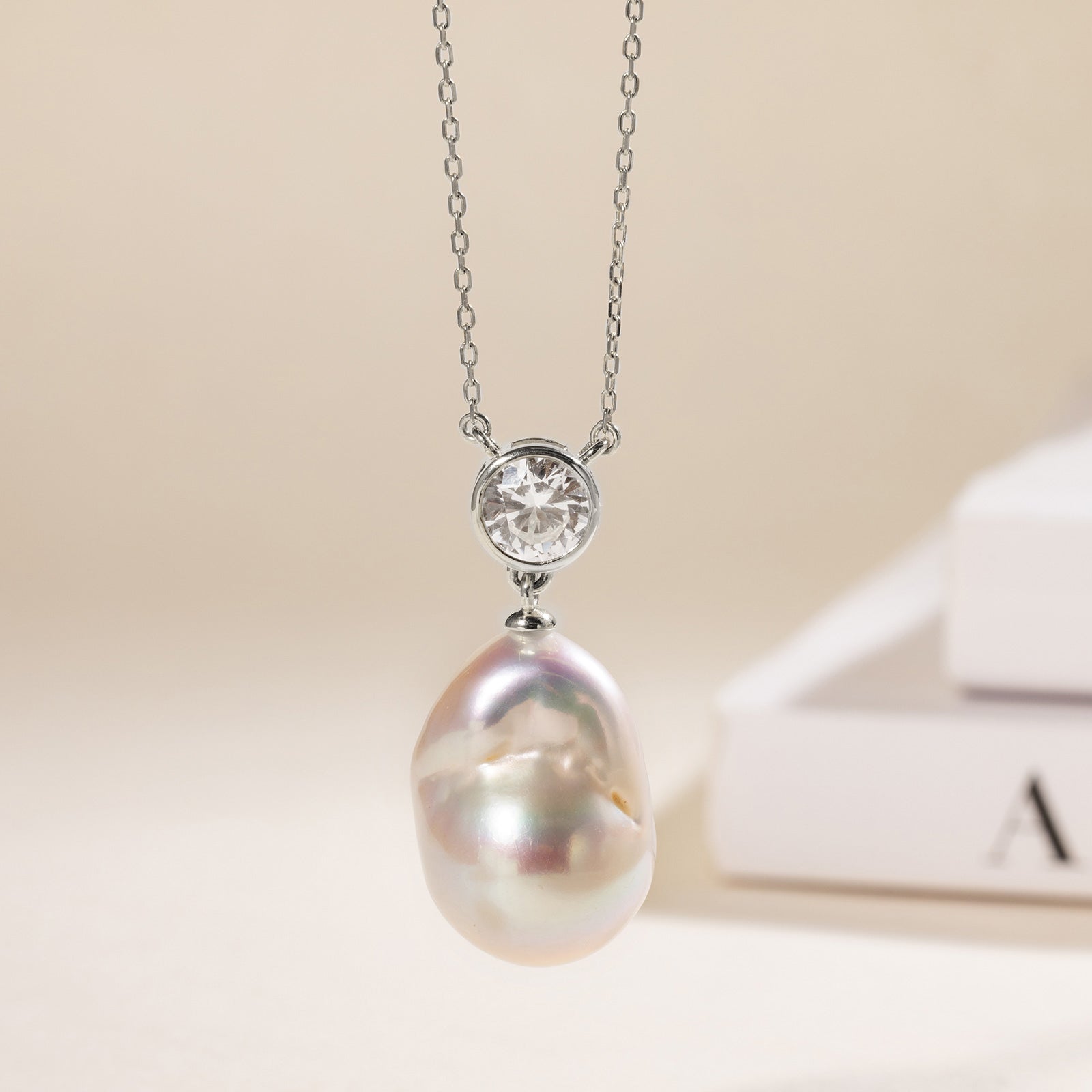 Baroque freshwater pearl and round cubic zirconia pendant necklace in white gold color display view