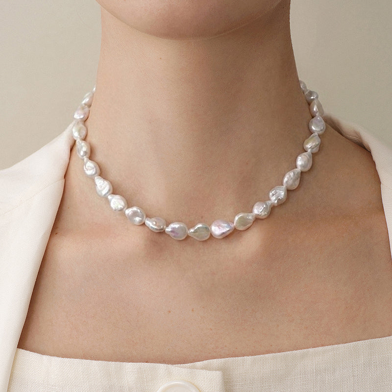 Model wearing baroque iridescent freshwater pearl strand necklace