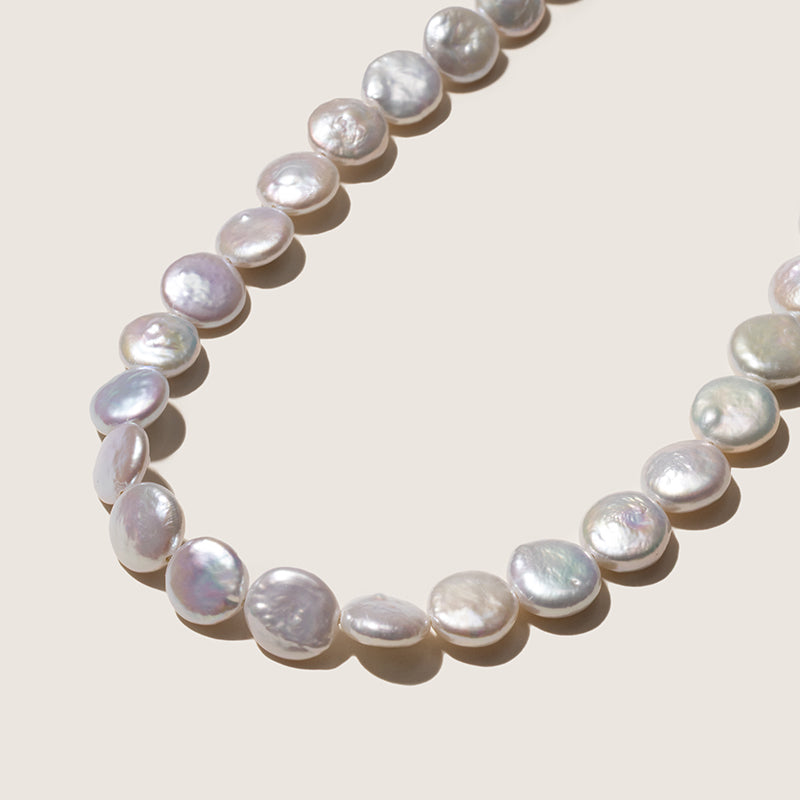 Button iridescent freshwater pearls 9.0 to 10.0mm close-up