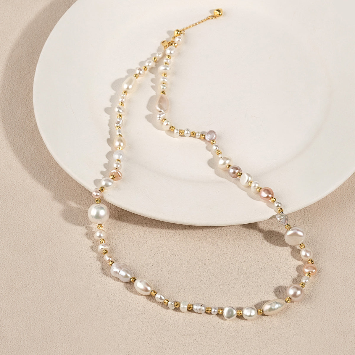 Model wearing a mixed freshwater baroque pearl strand necklace