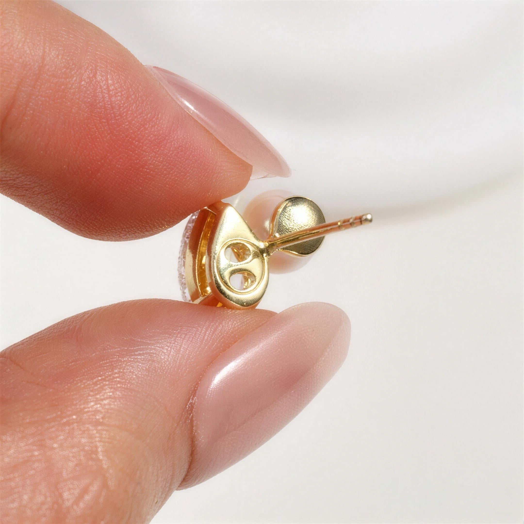Freshwater pearl and pear-shaped cubic zirconia stud earrings in yellow gold color lifestyle view