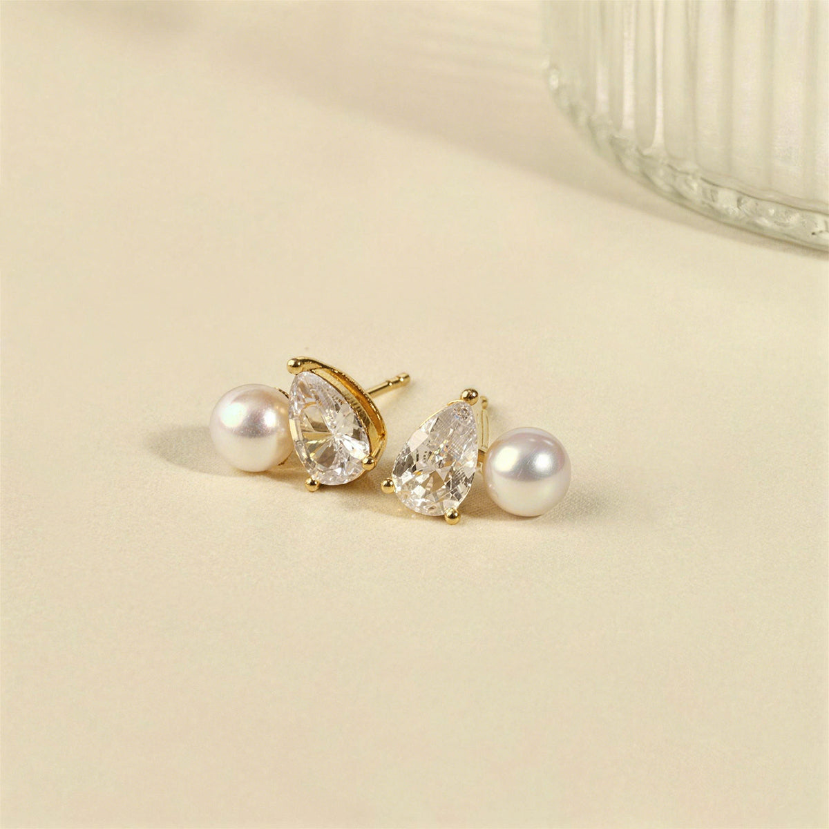 Freshwater pearl and pear-shaped cubic zirconia stud earrings yellow gold color specification card