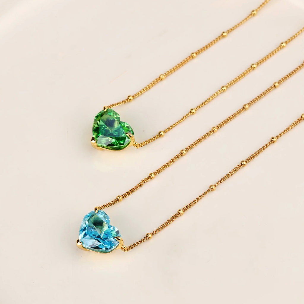 Blue and green heart cubic zirconia pendant necklaces on spaced bead chains