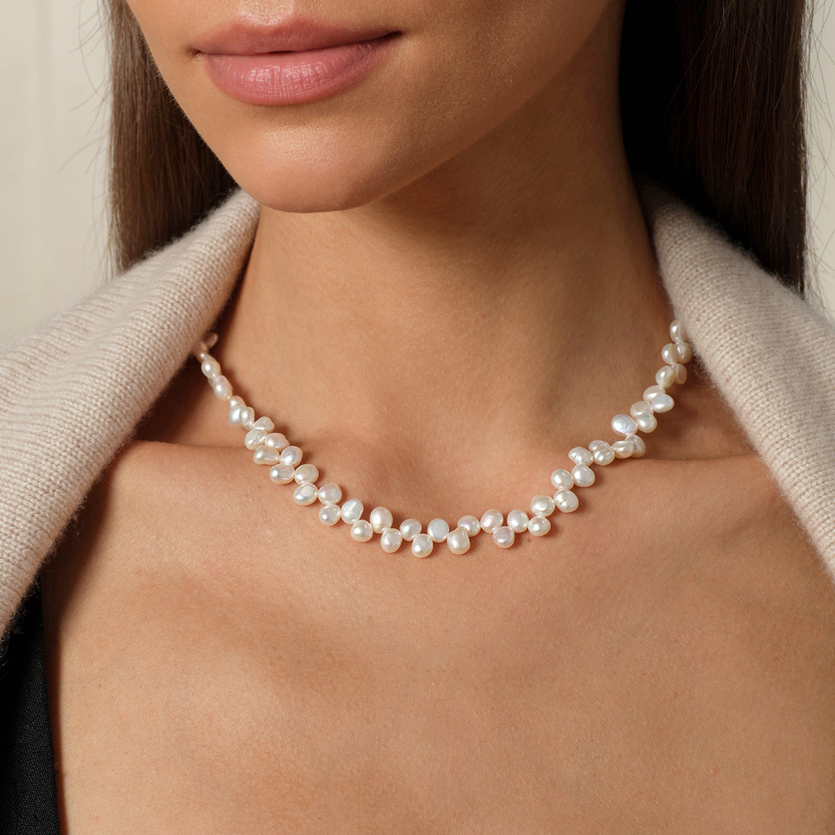 Model wearing the freshwater pearl bow clasp strand necklace