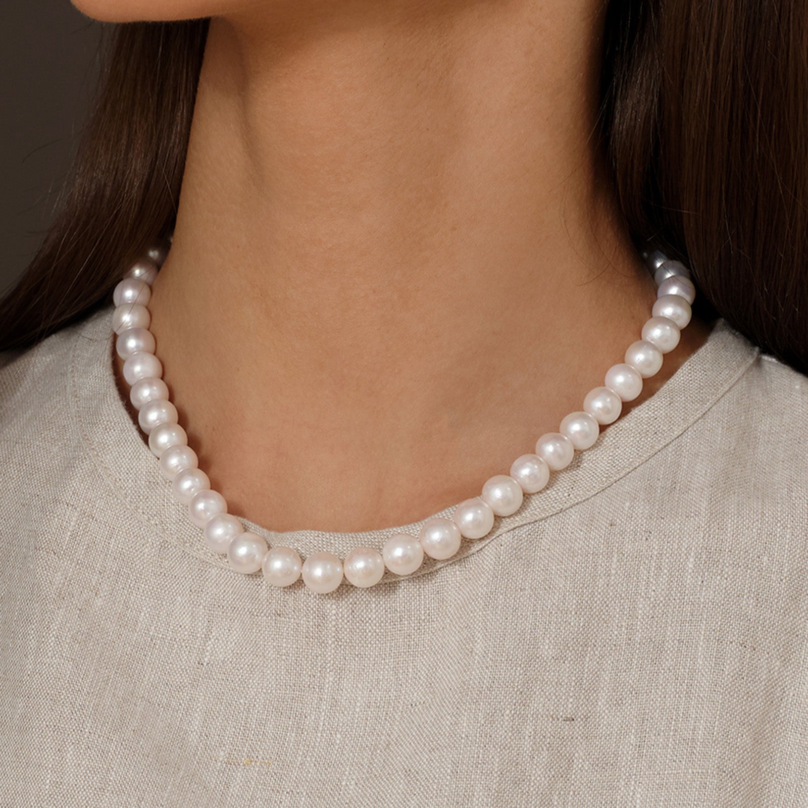 Close worn view of the 7.0-8.0mm freshwater pearl strand necklace