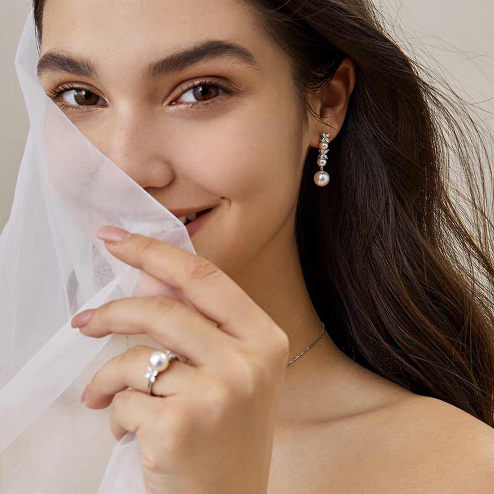 Model wearing freshwater pearl cubic zirconia dangle earrings