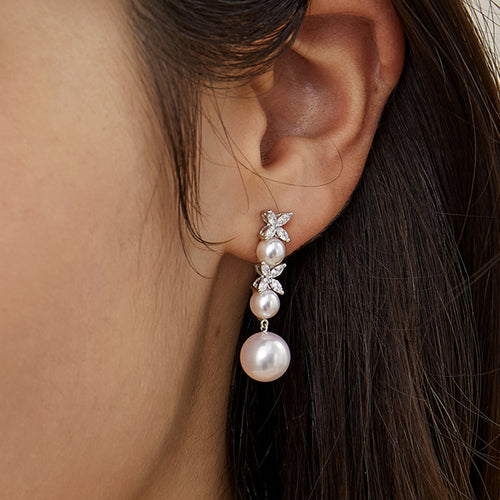 Close-up worn view showing the pearl drop length and cubic zirconia detail