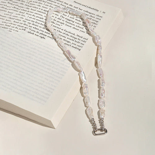 Baroque freshwater pearl strand necklace arranged with sterling silver connector detail