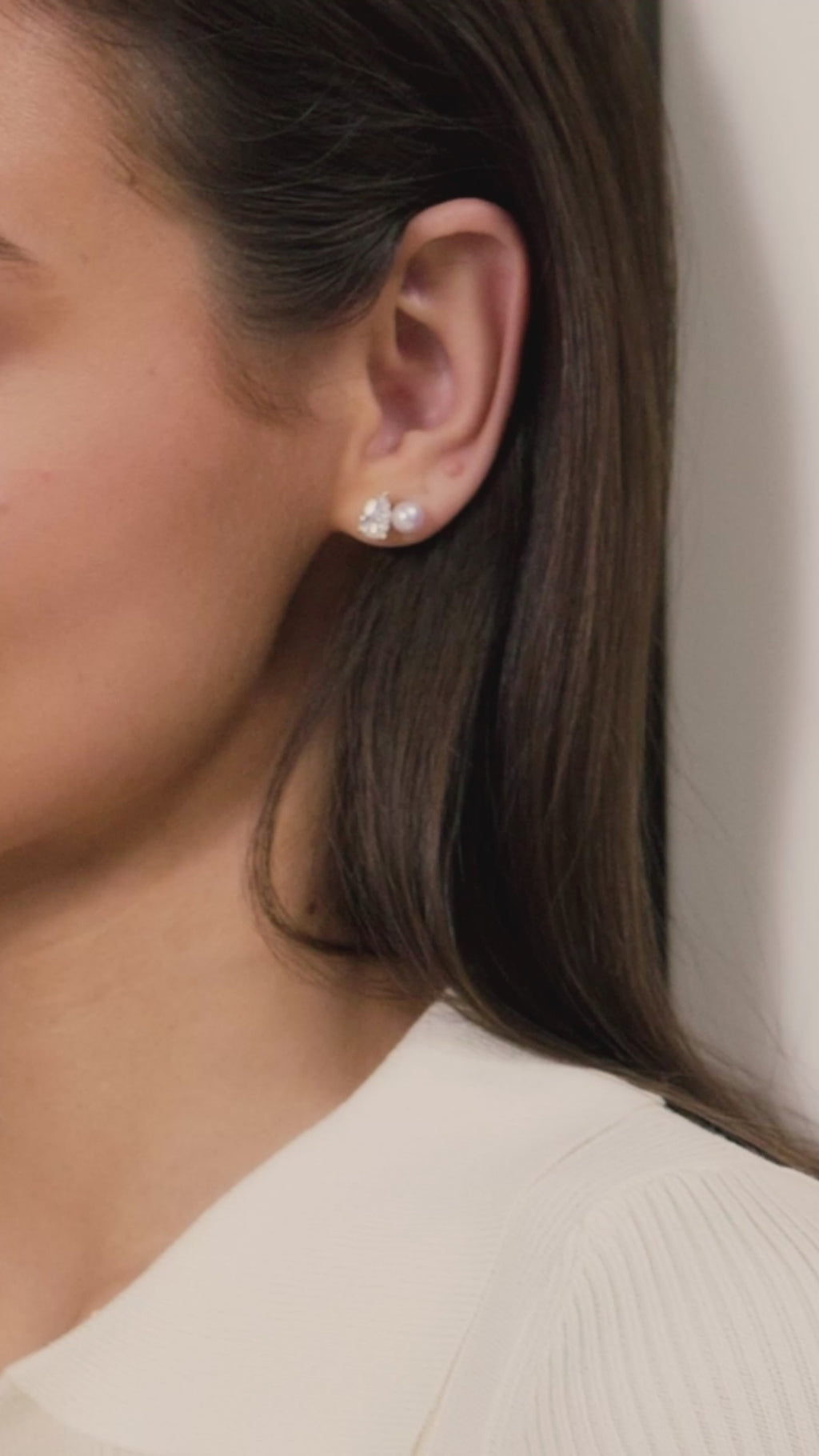 Model video for freshwater pearl and pear cubic zirconia stud earrings in yellow gold color