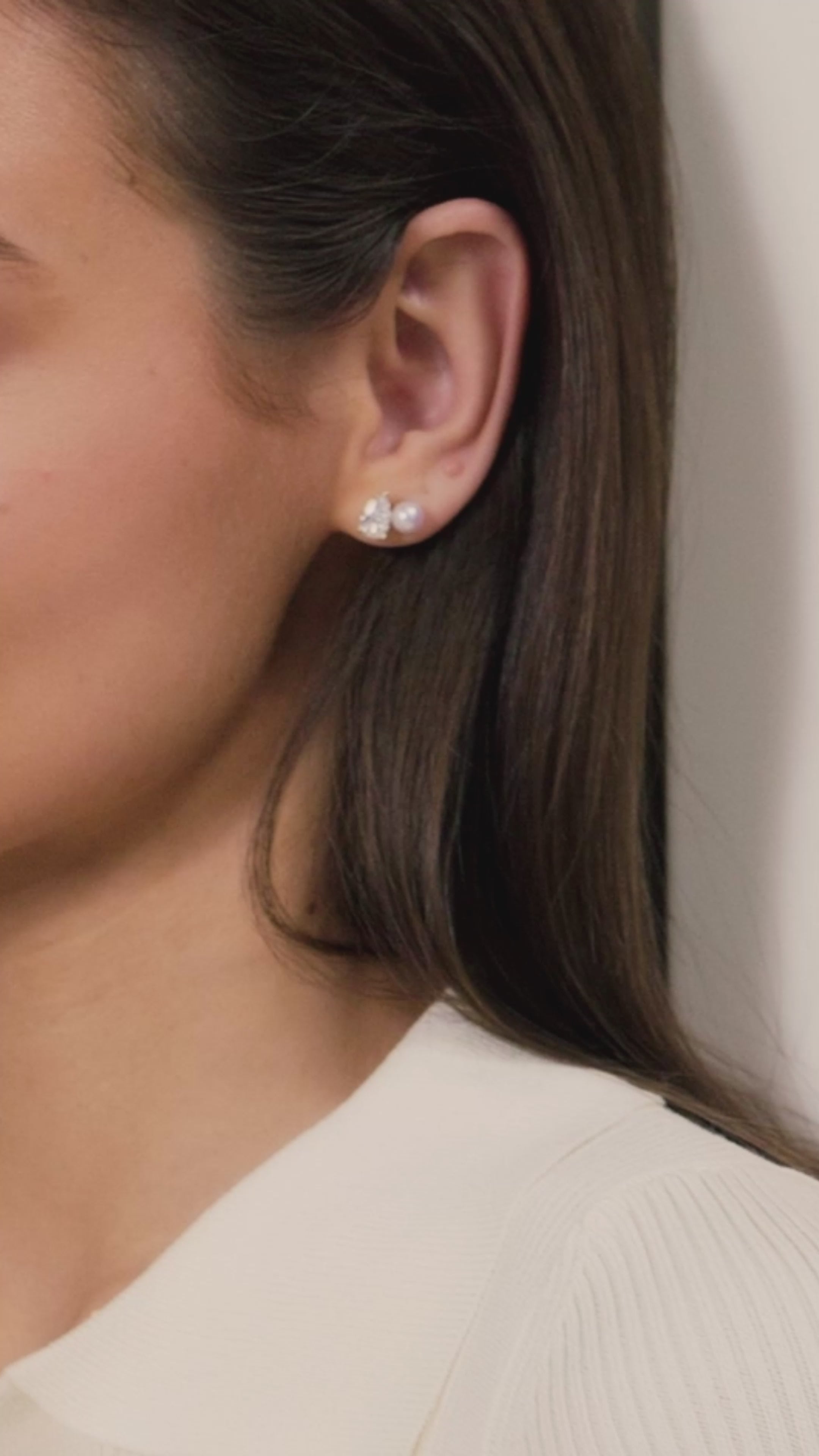 Model video for freshwater pearl and pear cubic zirconia stud earrings in yellow gold color