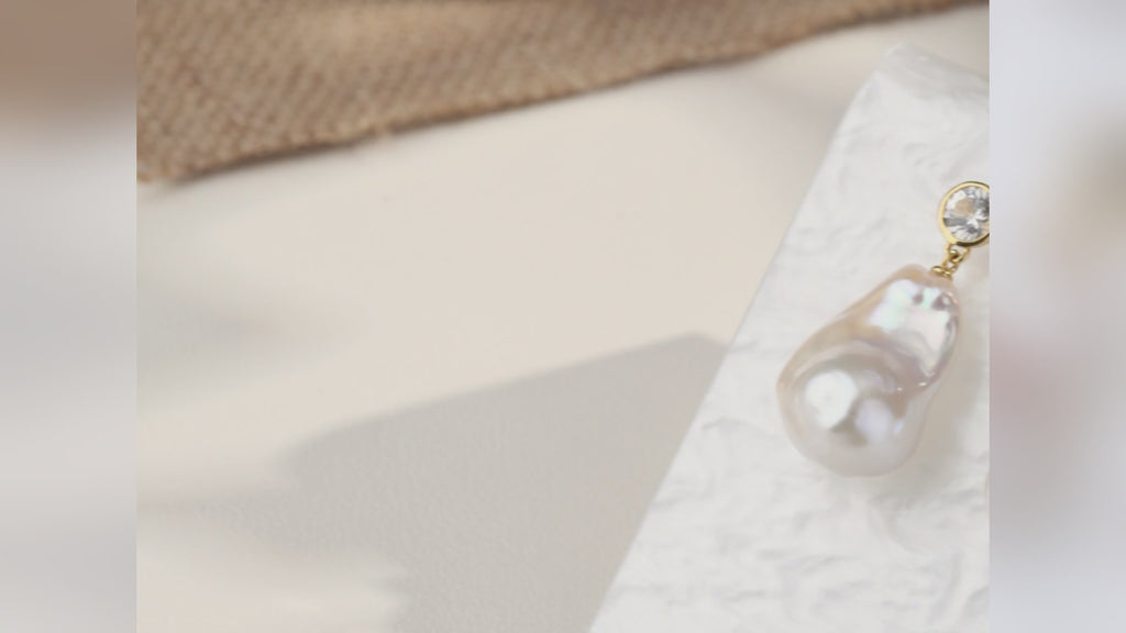 Product video for baroque freshwater pearl round cubic zirconia stud earrings in yellow gold color