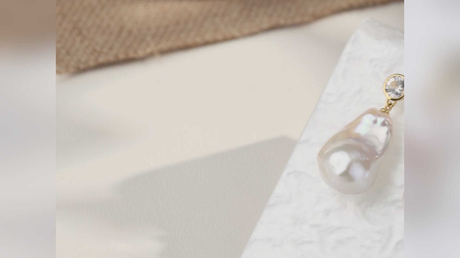 Product video for baroque freshwater pearl round cubic zirconia stud earrings in yellow gold color